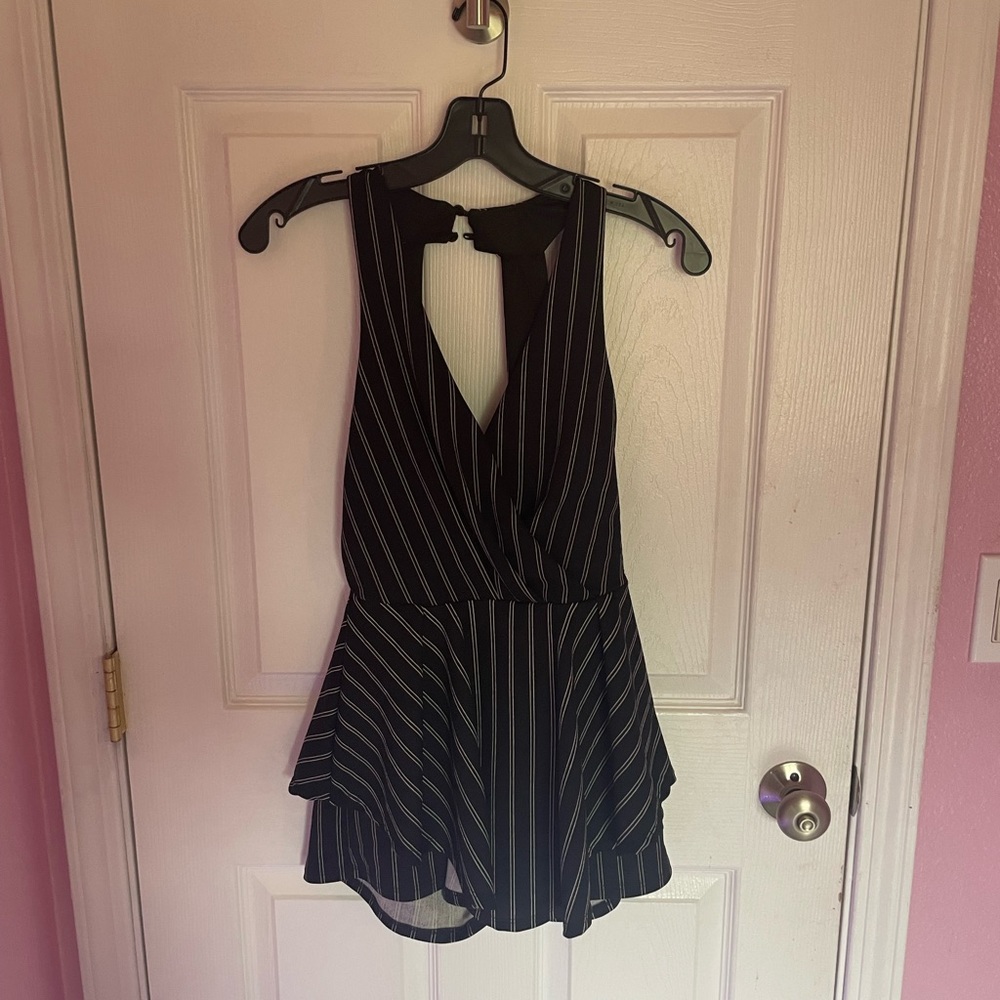 Darling black and white striped romper. Runs small (sized as medium).